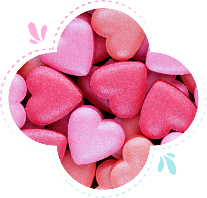 Group 1321317511 A collection of pink and red heart-shaped candy arranged closely together.